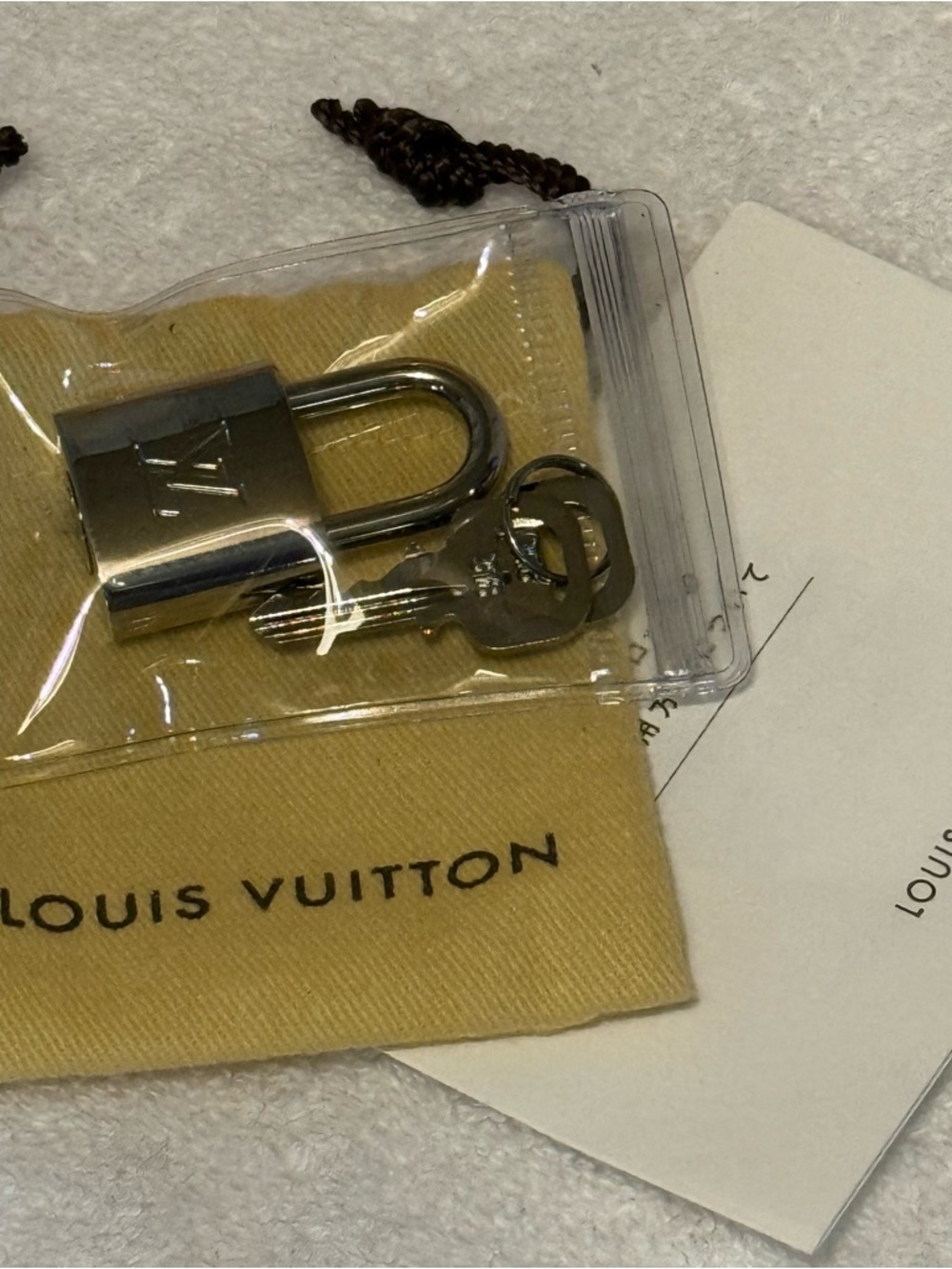 Louis Vuitton Silver-Tone Padlock with Branded Dust Bag and Box. - Picture 5 of 5